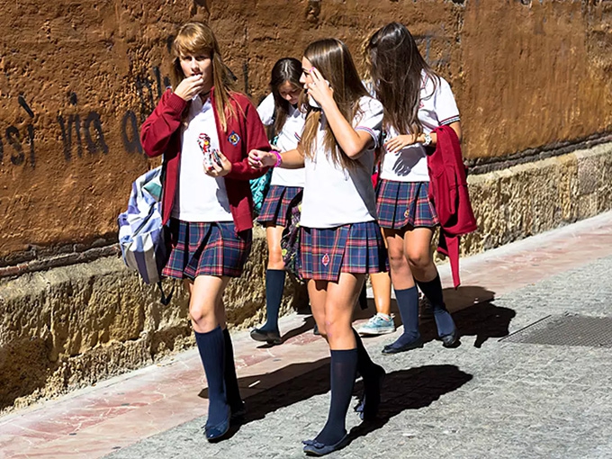 Why do some schools still force girls to wear skirts or dresses?