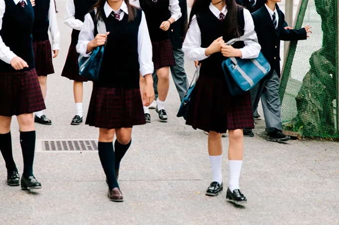 ‘I started walking the long way’: many young women first experience street harassment in their school uniforms